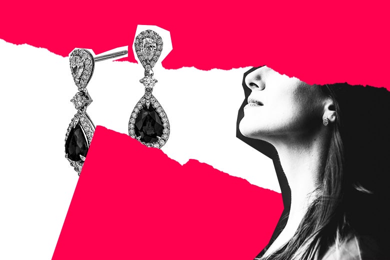 Expensive-looking earrings next to a woman’s neck.